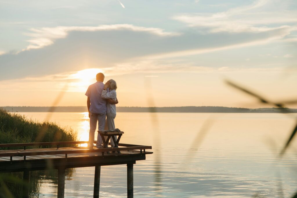 A retired couple enjoying the sunset and retirement